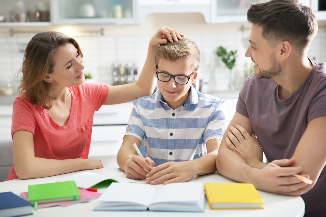 Parents Helping Teen with Schoolwork